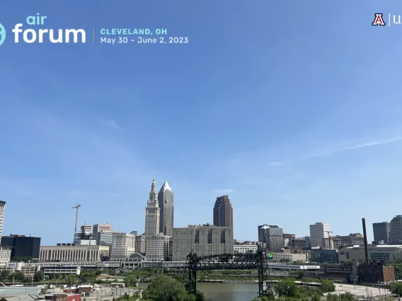 Skyline of Cleveland Ohio with the "AIR Forum" logo and UAIR logo at the top corners of the image