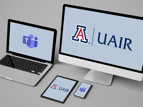 Desktop with UAIR logo on screen and laptop with MS Teams logo on screen
